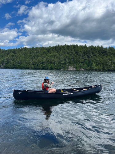 Nova Craft Prospector 16 Blue Steel being paddled solo.