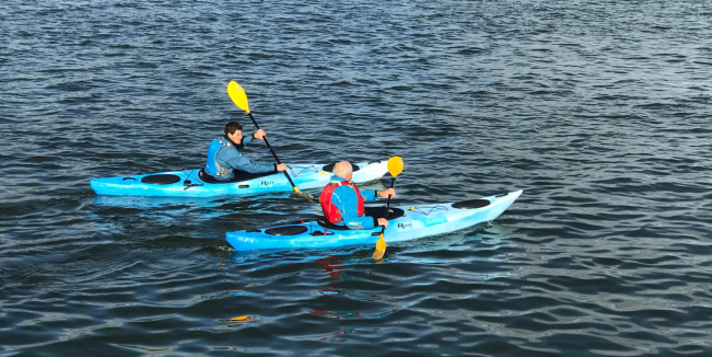 Riot Enduro 12 Touring Kayaks Paddling As A Pair In Choppy Waters 