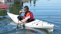 Riot Intrigue Ultralight Touring Kayak Paddling On A River